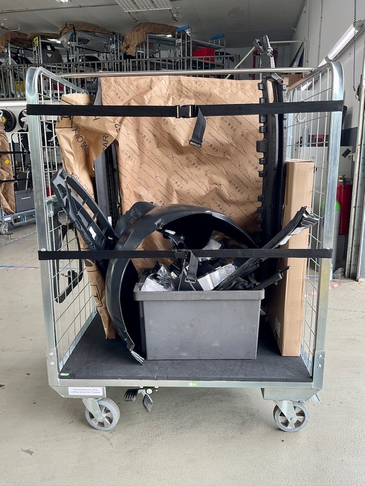 Loggyflex Maxi loaded with body parts, a wheel arch liner and a small parts bin, secured with lashing straps