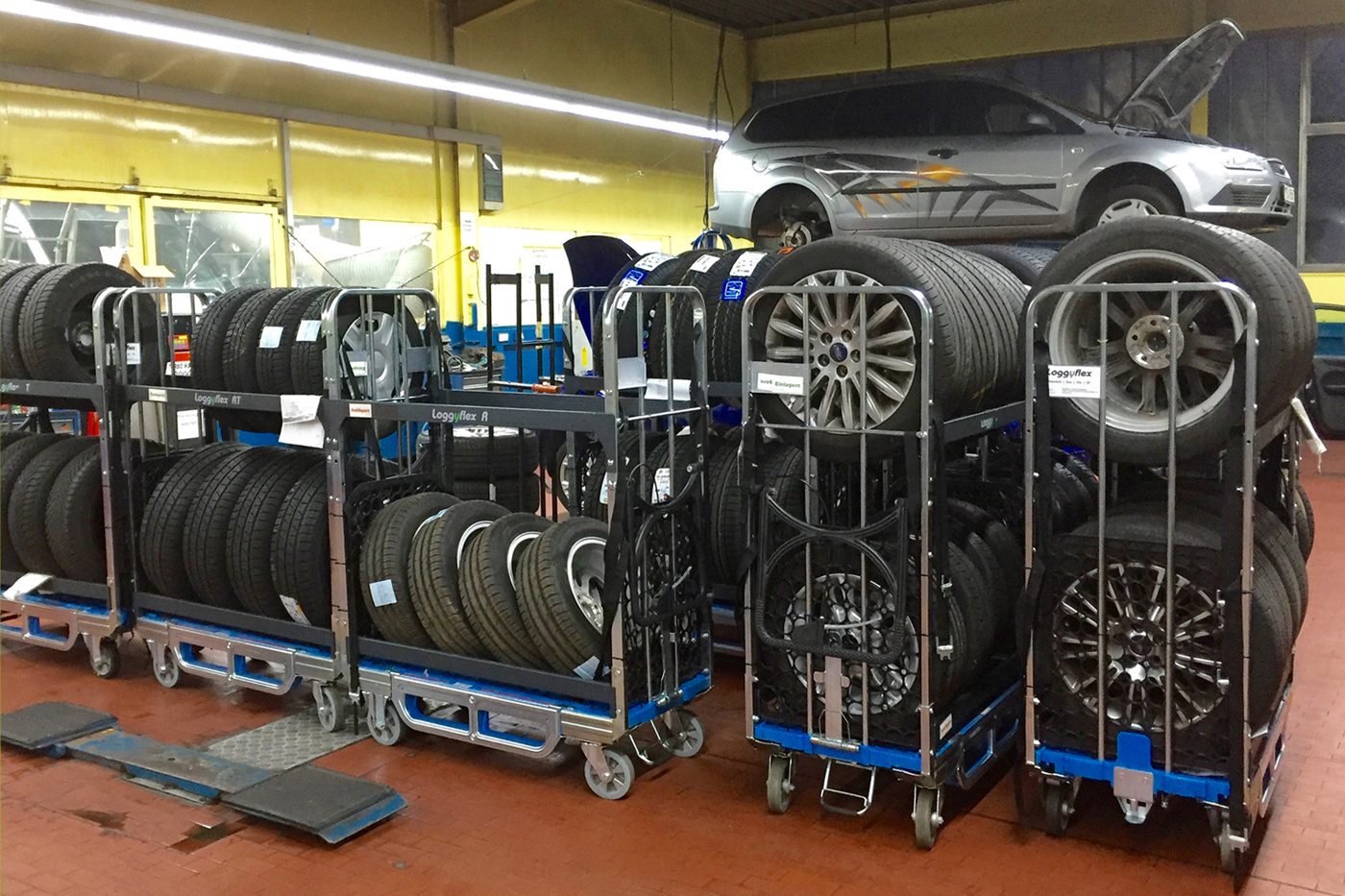 Row of Loggyflex RT 255 trolleys with wheels and tyres in the workshop