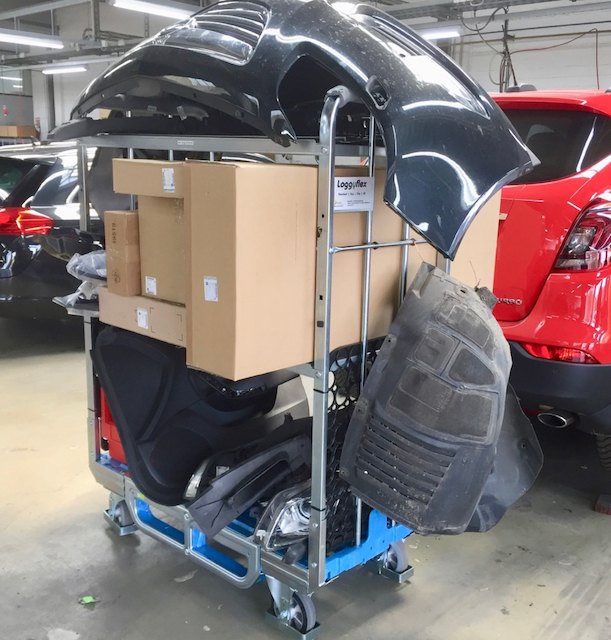 Loggyflex Trio with a bumper, wheel arch liner and spare parts boxes in the body shop